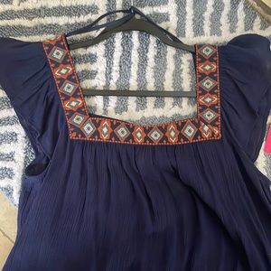 Never worn, with tags. Xhiliration navy top.